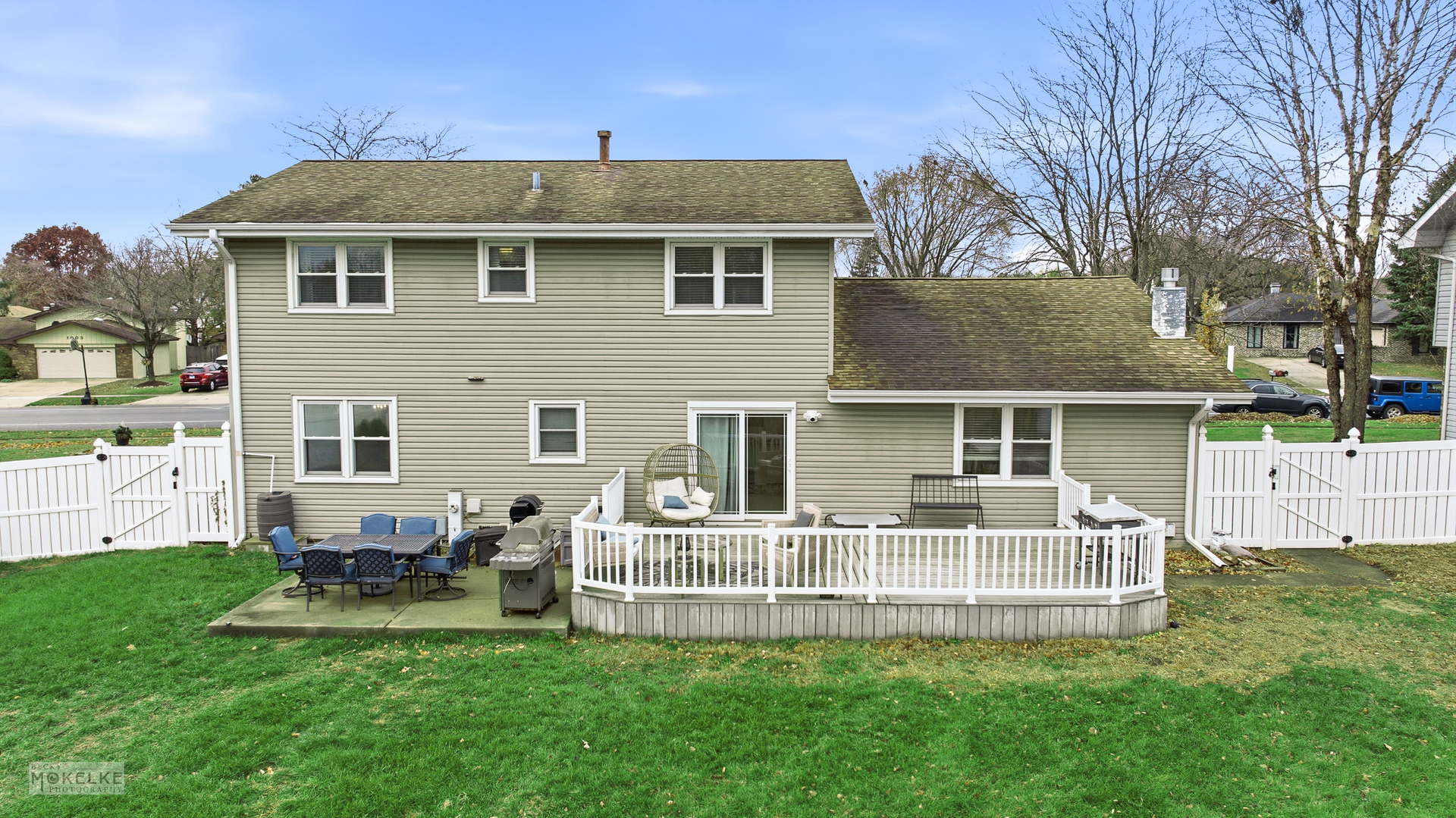 1000 South Raven Road Shorewood, IL 60404 - Photo 32 of 43 a front view of a house with a yard table and chairs