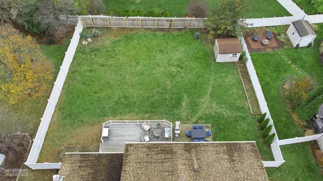 a view of house with backyard