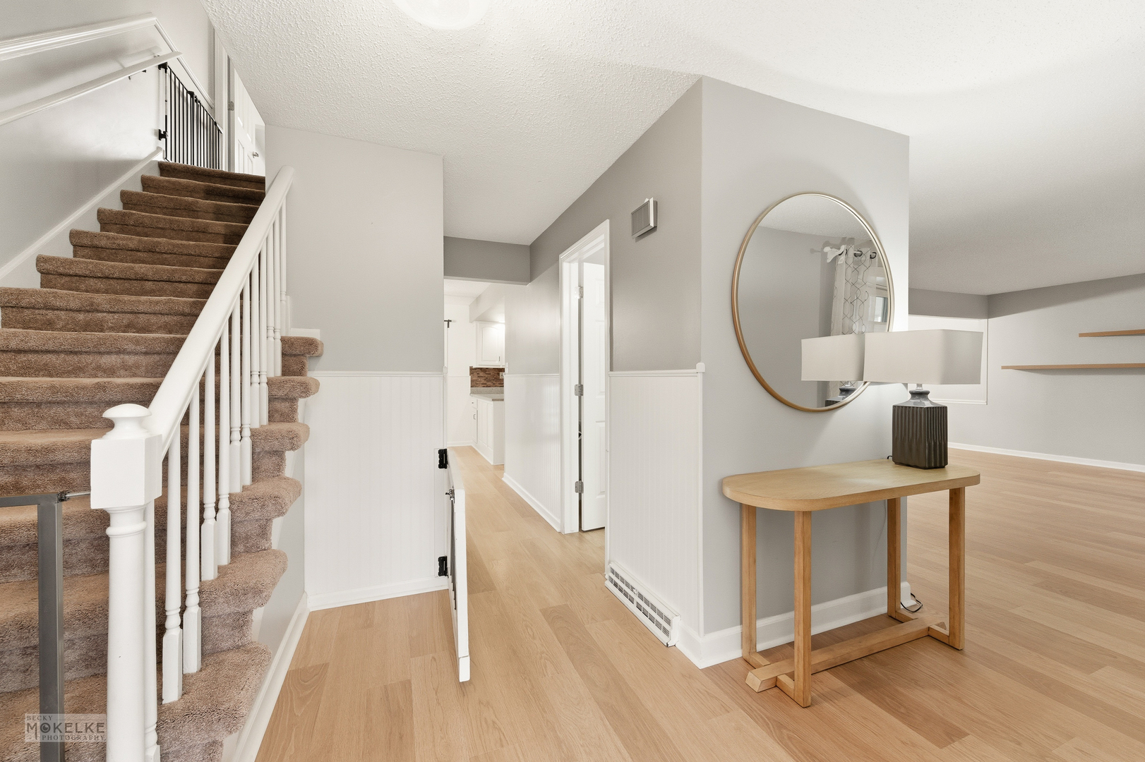 1000 South Raven Road Shorewood, IL 60404 - Photo 4 of 43 a view of a hallway with entryway wooden floor and front door