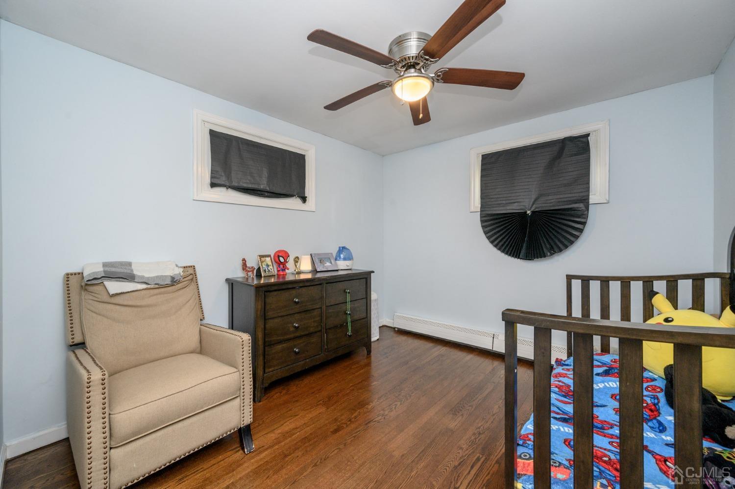 60 Ocean Boulevard Old Bridge, NJ 07735 - Photo 13 of 25 a living room with furniture and a flat screen tv