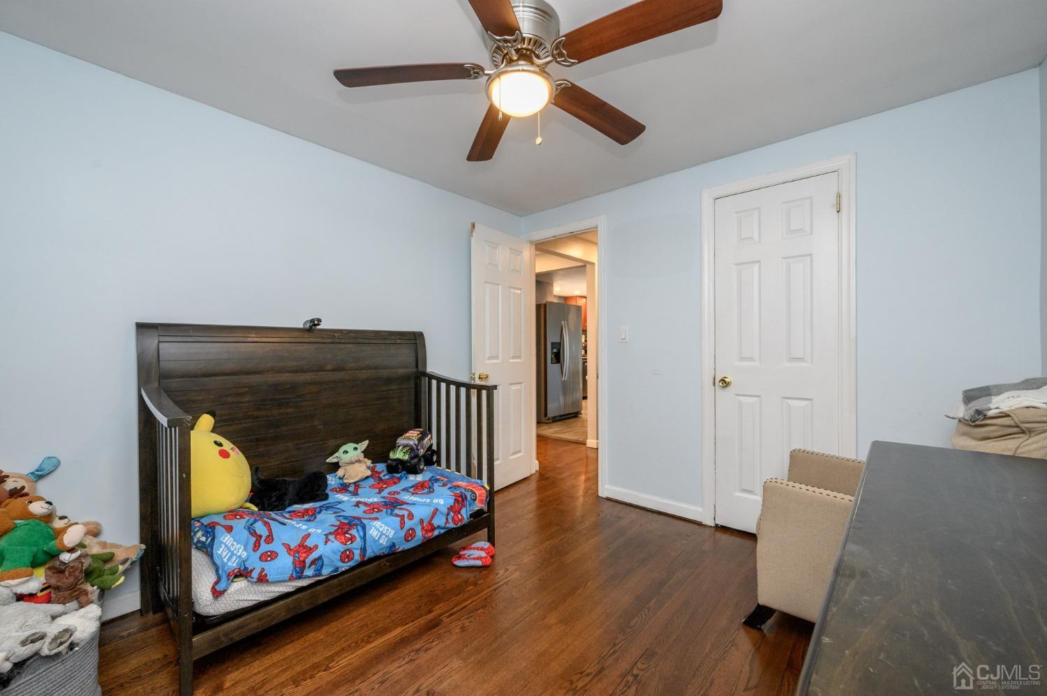 60 Ocean Boulevard Old Bridge, NJ 07735 - Photo 14 of 25 a bedroom with furniture and a fireplace