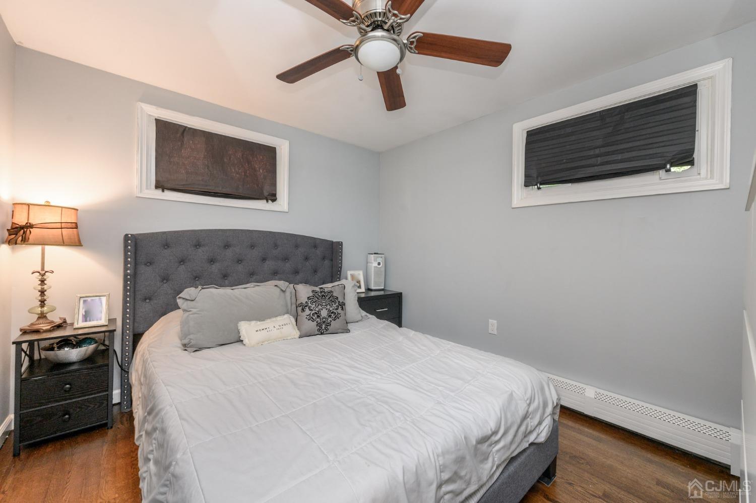 60 Ocean Boulevard Old Bridge, NJ 07735 - Photo 16 of 25 a bedroom with a bed and a flat screen tv