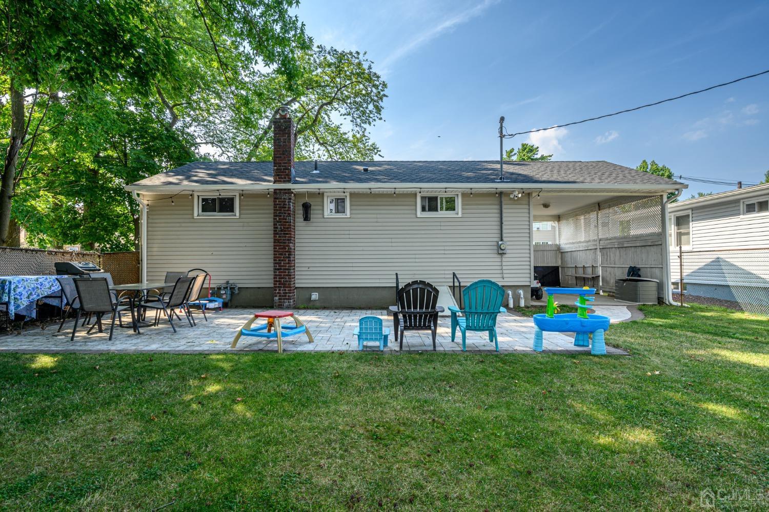 60 Ocean Boulevard Old Bridge, NJ 07735 - Photo 20 of 25 a front view of a house with garden and sitting area