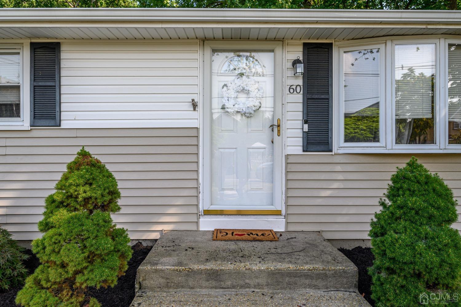 60 Ocean Boulevard Old Bridge, NJ 07735 - Photo 2 of 25 a small white building with a white roof and a window
