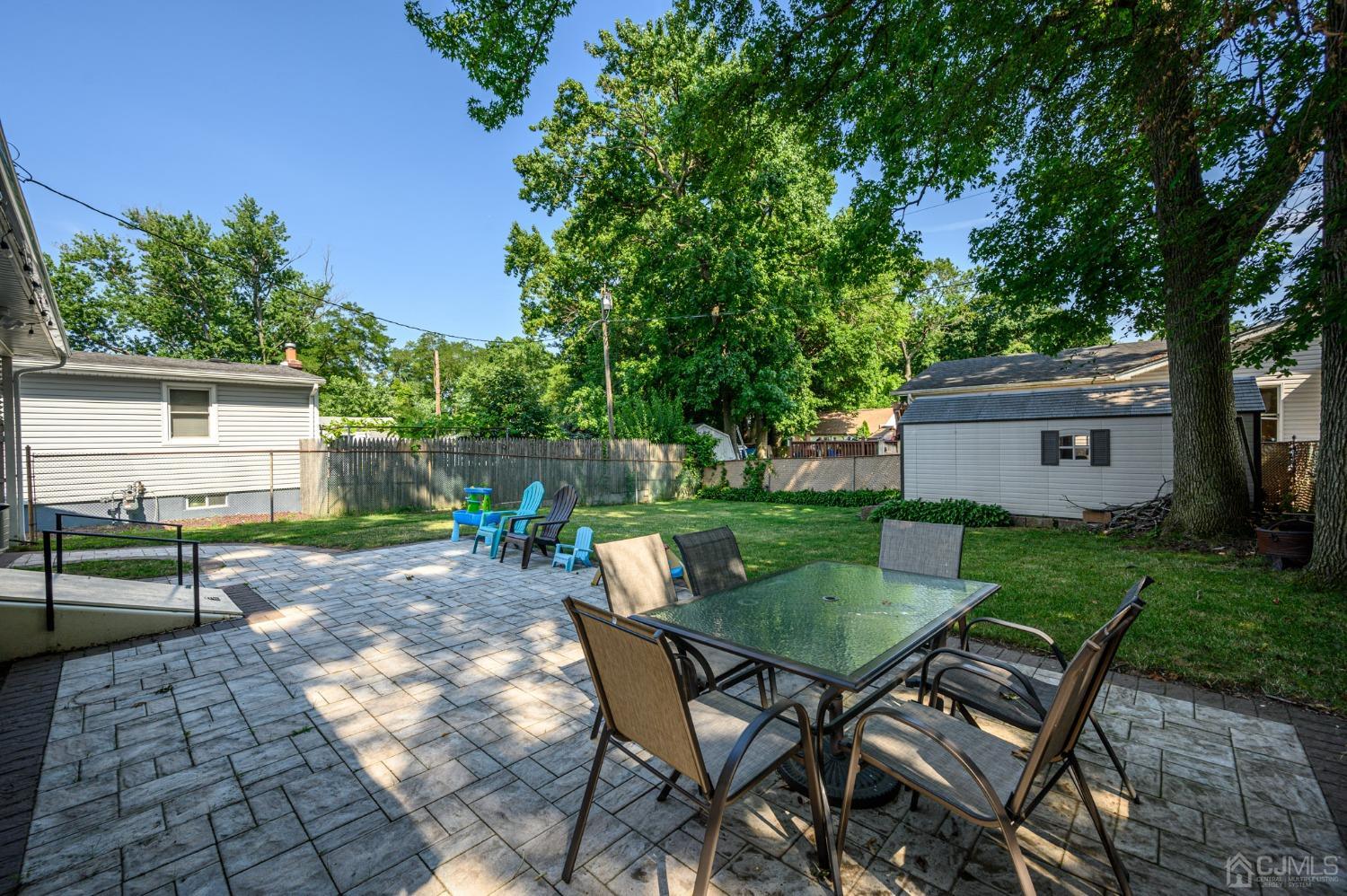 60 Ocean Boulevard Old Bridge, NJ 07735 - Photo 22 of 25 a view of a chairs and table in backyard of the house