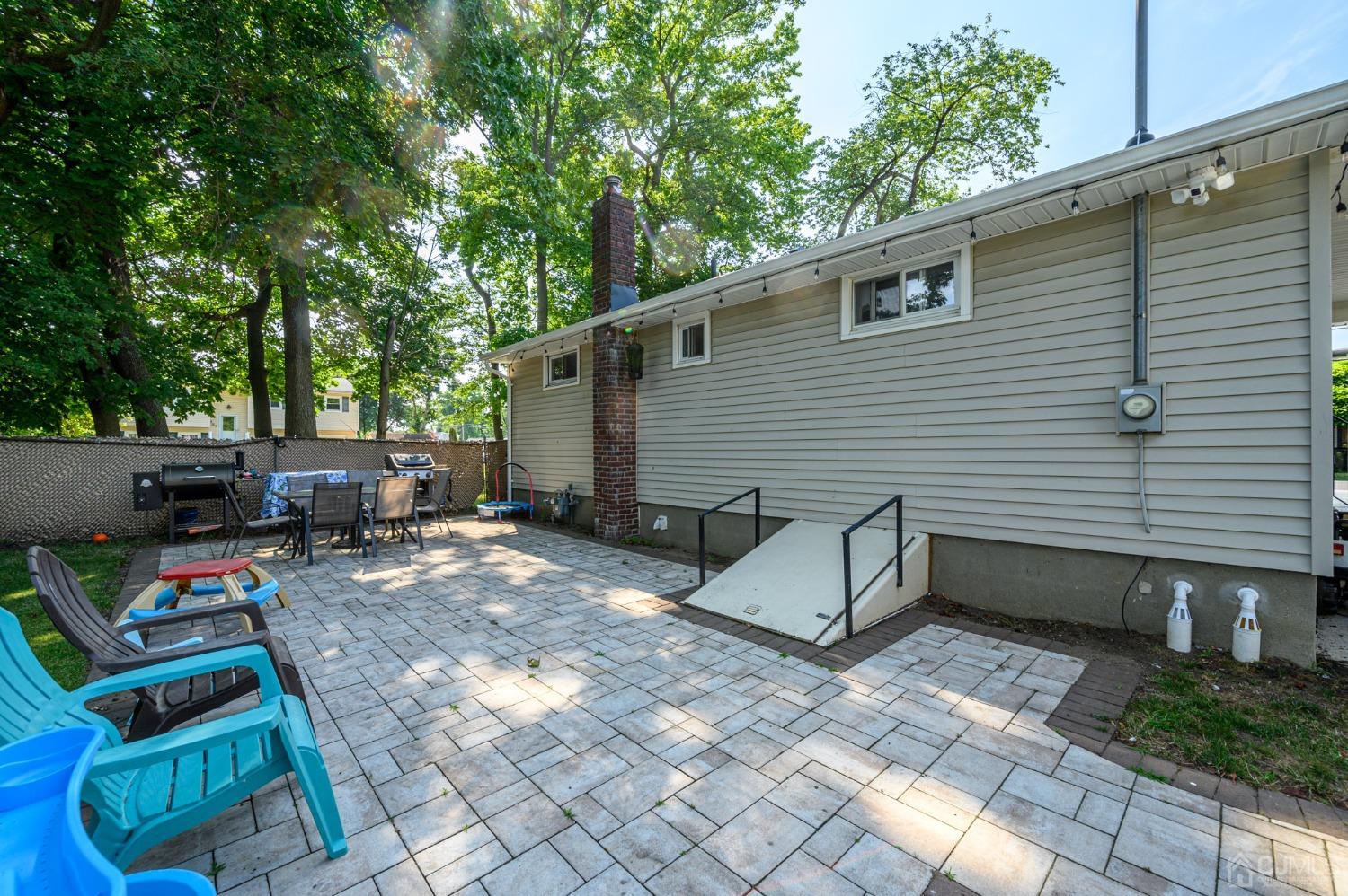60 Ocean Boulevard Old Bridge, NJ 07735 - Photo 23 of 25 a view of backyard with outdoor seating and trees