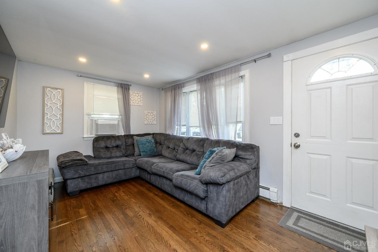 60 Ocean Boulevard Old Bridge, NJ 07735 - Photo 5 of 25 a living room with furniture and a wooden floor