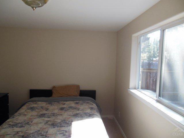 17246 Indio Road Bend, OR 97707 - Photo 12 of 21 a bedroom with a bed and a window