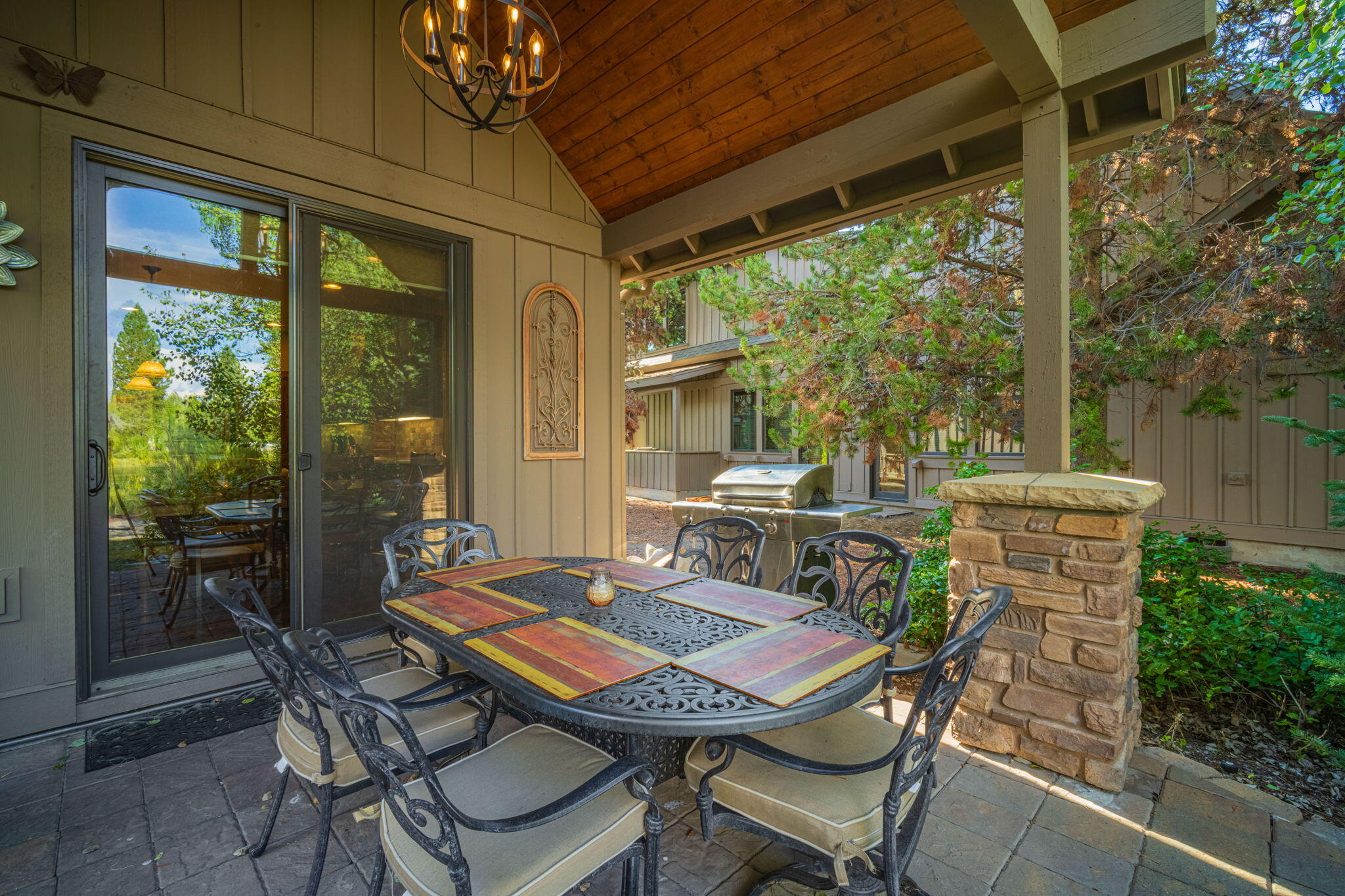 56508 Dancing Rock Loop, Unit 22 Bend, OR 97707 - Photo 49 of 69 a view of an outdoor dining space with a table and chairs