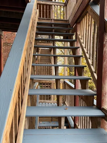a white toilet sitting next to a bathroom sink