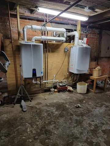 a kitchen with stainless steel appliances granite countertop a stove top oven a refrigerator a sink and dishwasher with wooden floor