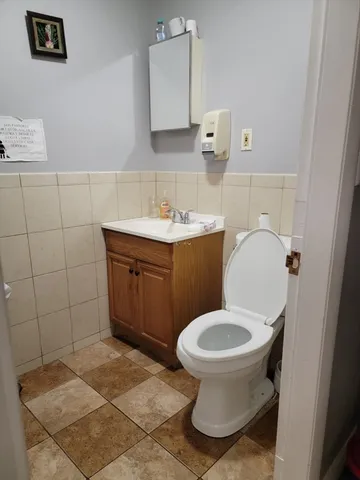 a bathroom with a sink toilet and vanity