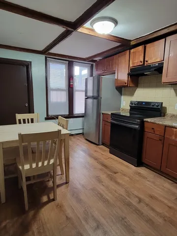 a kitchen with stainless steel appliances granite countertop a stove a sink dishwasher and cabinets