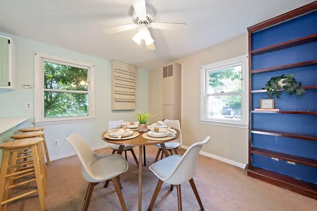 a view of a dining room with furniture window and outside view