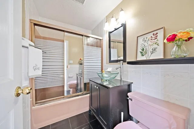 a bathroom with a toilet a sink and a bathtub