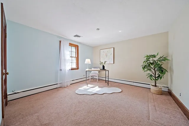 a view of a livingroom with a patio and a window
