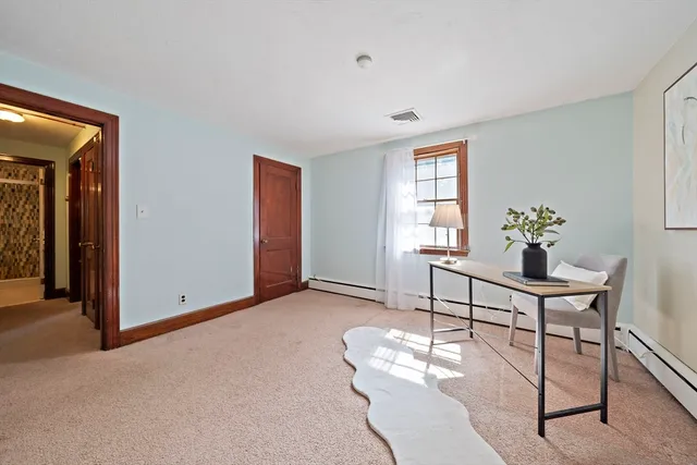 a workspace with furniture and window