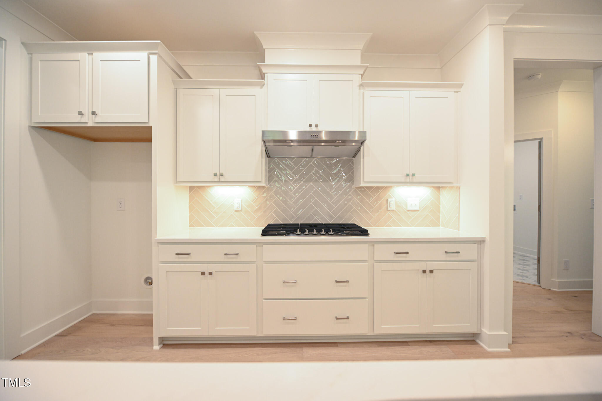 170 Sallyport Court Raleigh, NC 27603 - Photo 14 of 47 a kitchen with granite countertop white cabinets and white appliances