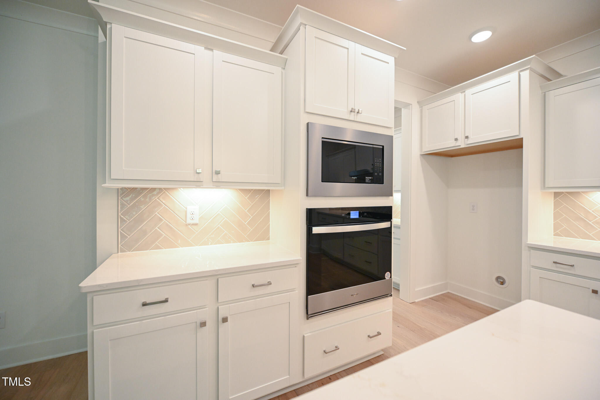 170 Sallyport Court Raleigh, NC 27603 - Photo 15 of 47 a kitchen with granite countertop white cabinets and white appliances