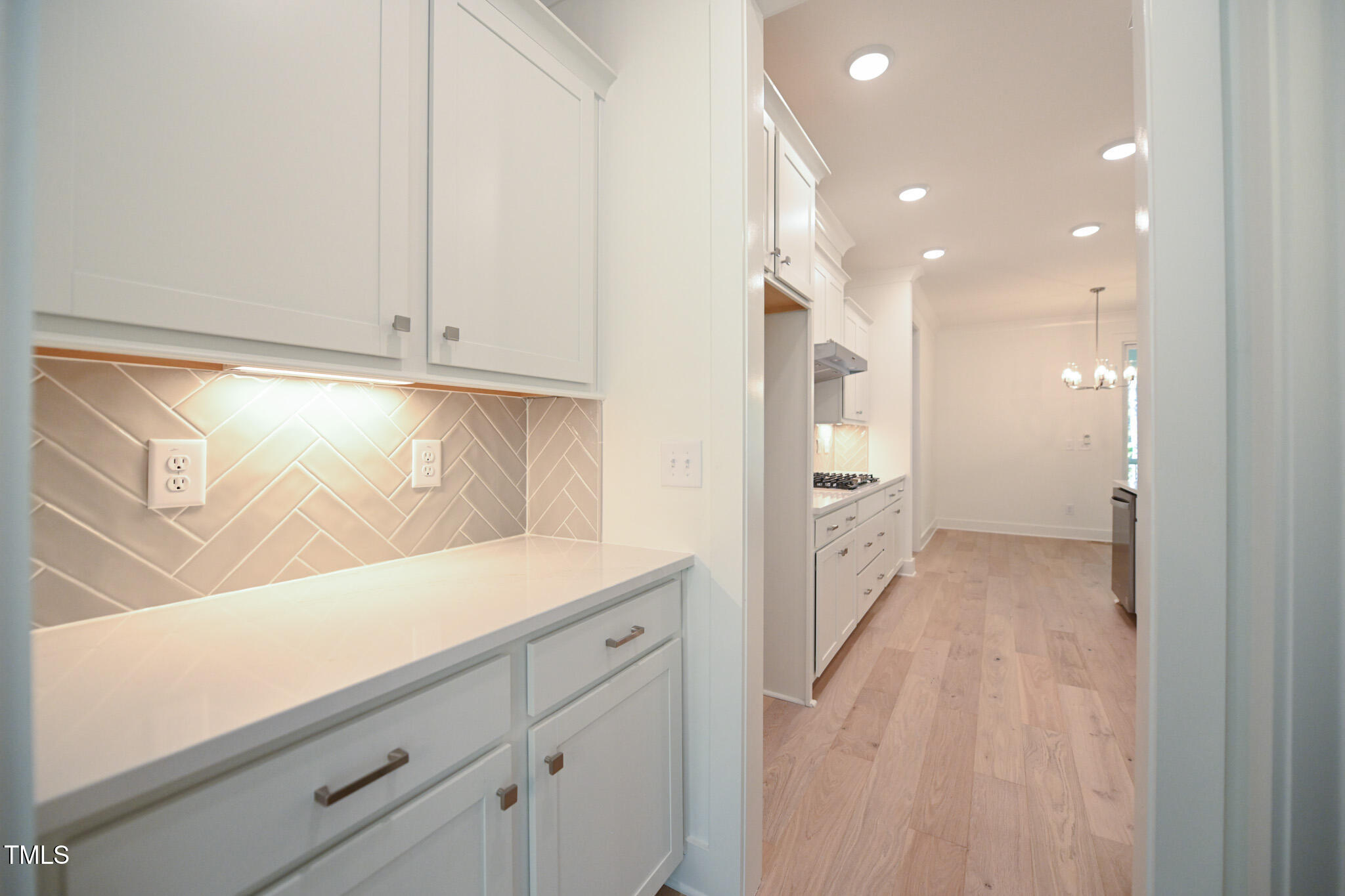 170 Sallyport Court Raleigh, NC 27603 - Photo 17 of 47 a view of a hallway to the kitchen