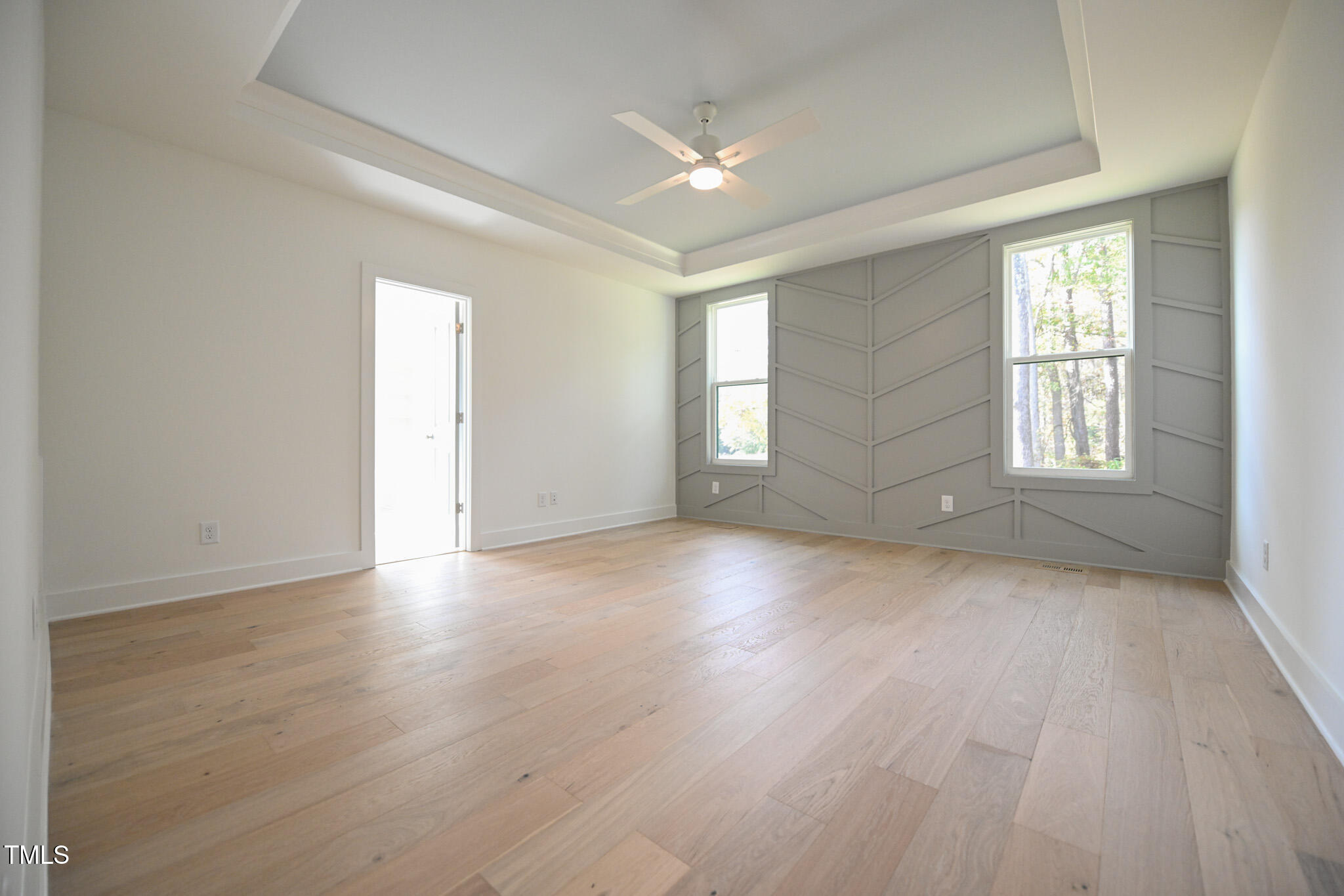 170 Sallyport Court Raleigh, NC 27603 - Photo 22 of 47 an empty room with wooden floor and windows