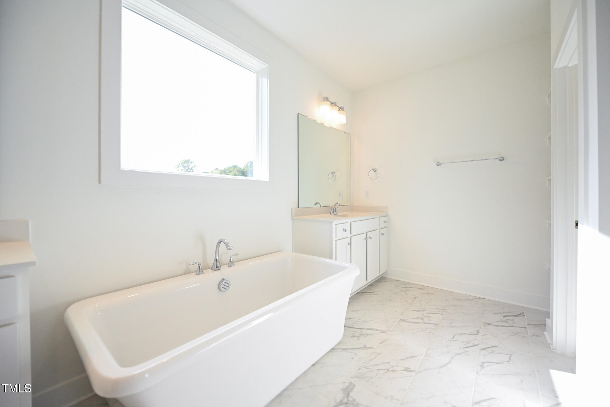 170 Sallyport Court Raleigh, NC 27603 - Photo 26 of 47 a white bath tub sitting next to a white sink