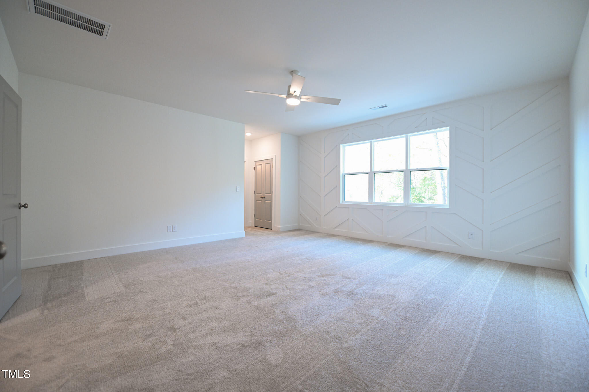 170 Sallyport Court Raleigh, NC 27603 - Photo 35 of 47 an empty room with a window and ceiling fan