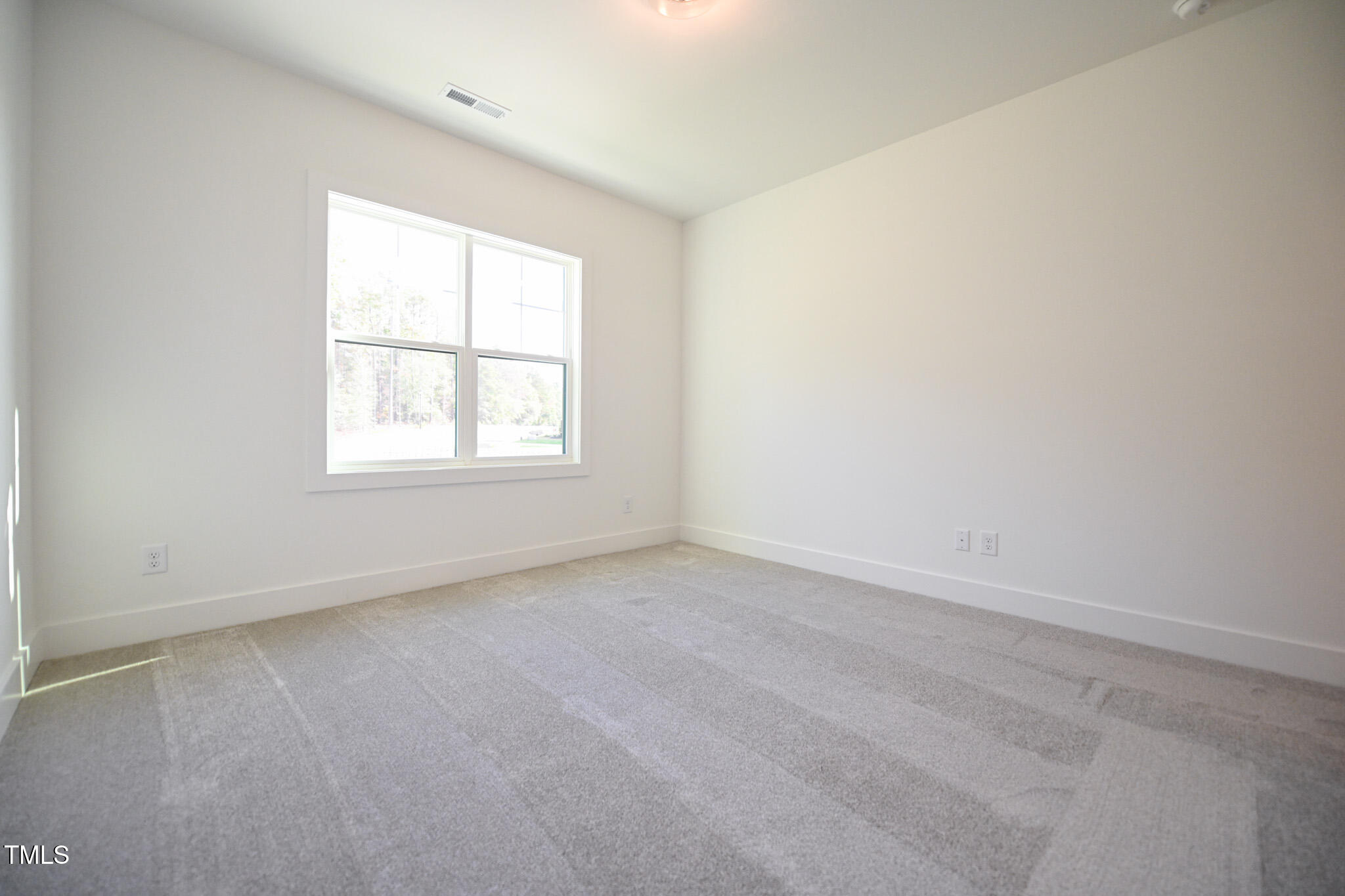 170 Sallyport Court Raleigh, NC 27603 - Photo 39 of 47 an empty room with a window