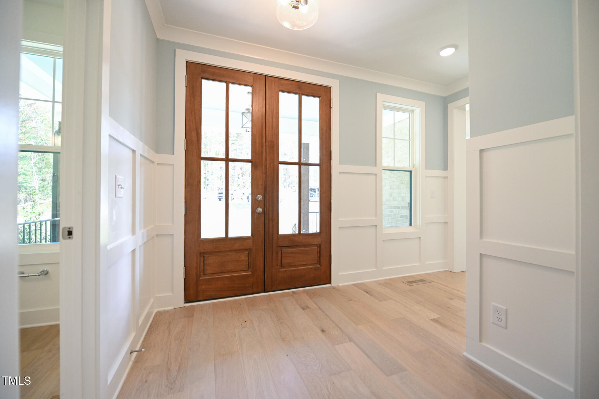 170 Sallyport Court Raleigh, NC 27603 - Photo 4 of 47 an empty room with wooden floor and windows