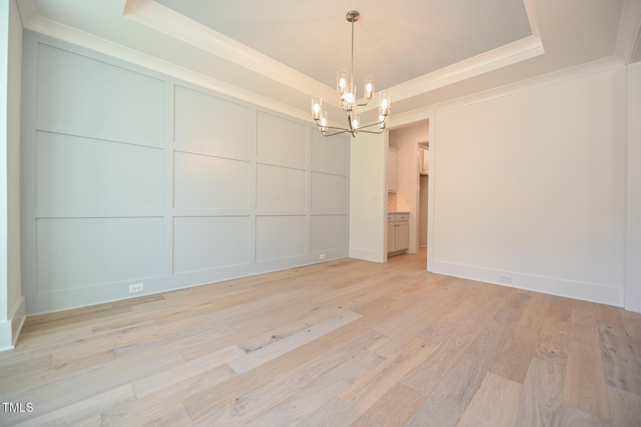 170 Sallyport Court Raleigh, NC 27603 - Photo 7 of 47 wooden floor in an empty room with a chandelier