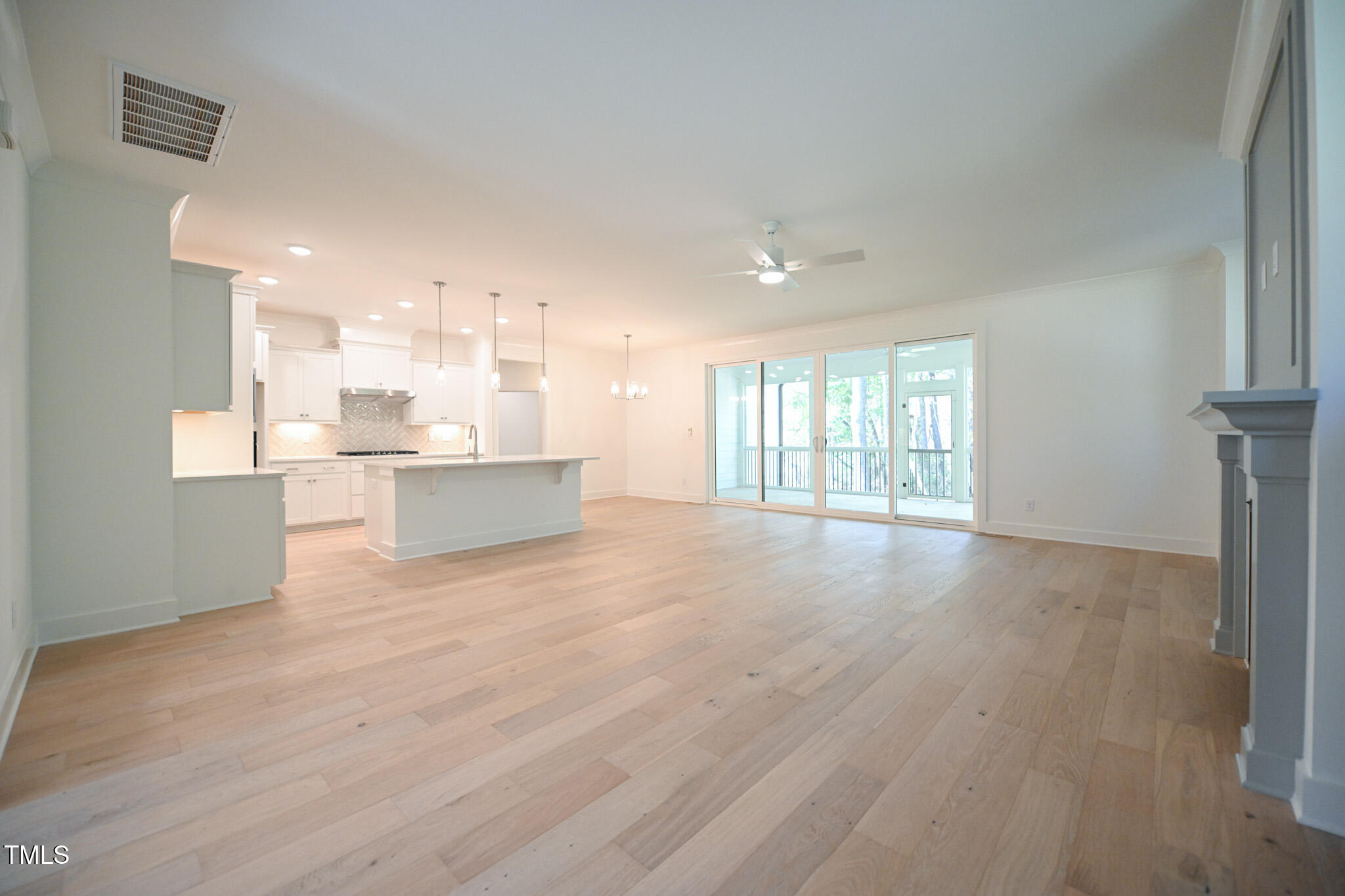 170 Sallyport Court Raleigh, NC 27603 - Photo 8 of 47 a view of a big room with wooden floor and windows