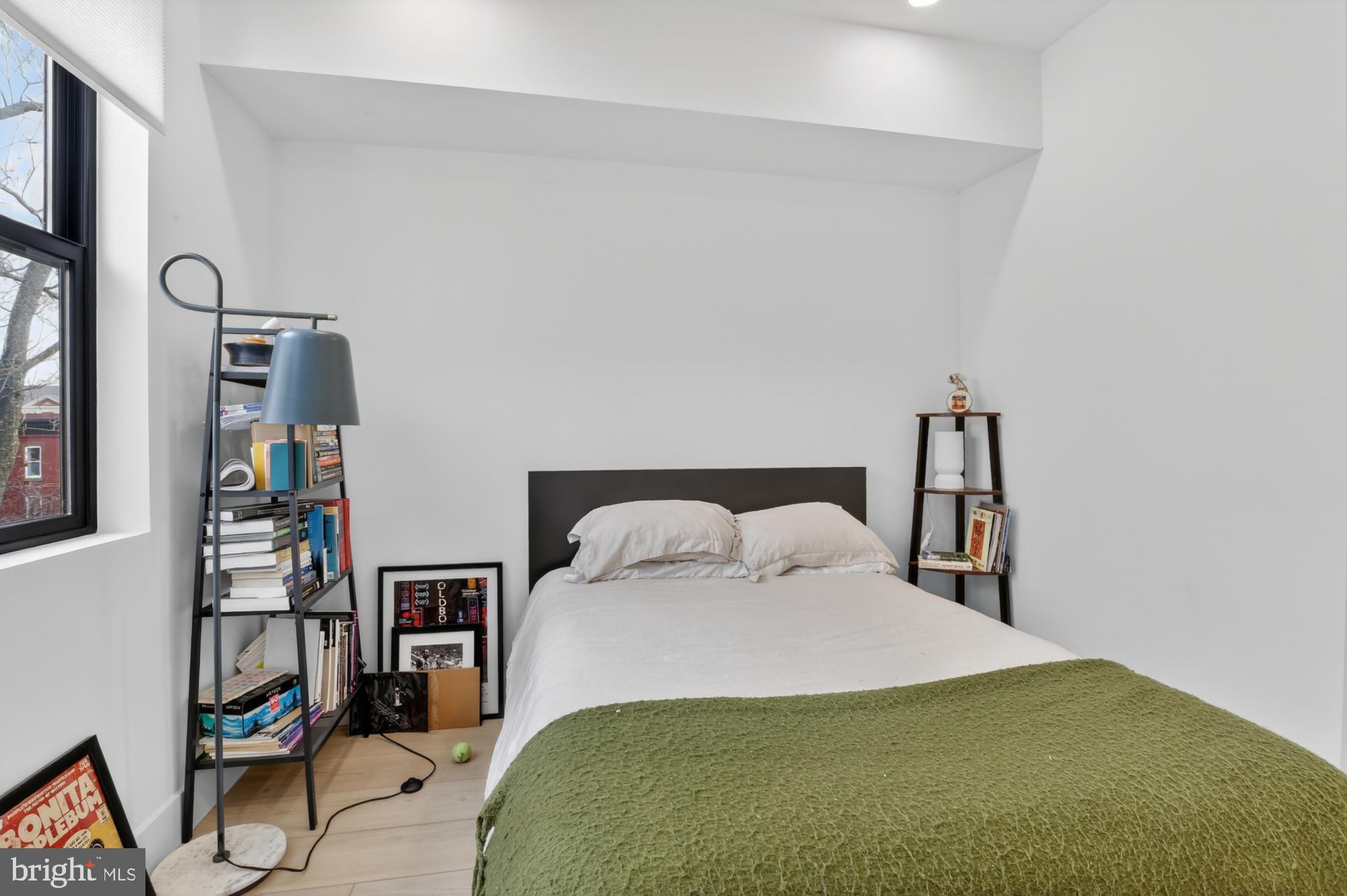 2007 Cambridge Street, Unit 9 Philadelphia, PA 19130 - Photo 13 of 33 a bedroom with a bed and a bookshelf