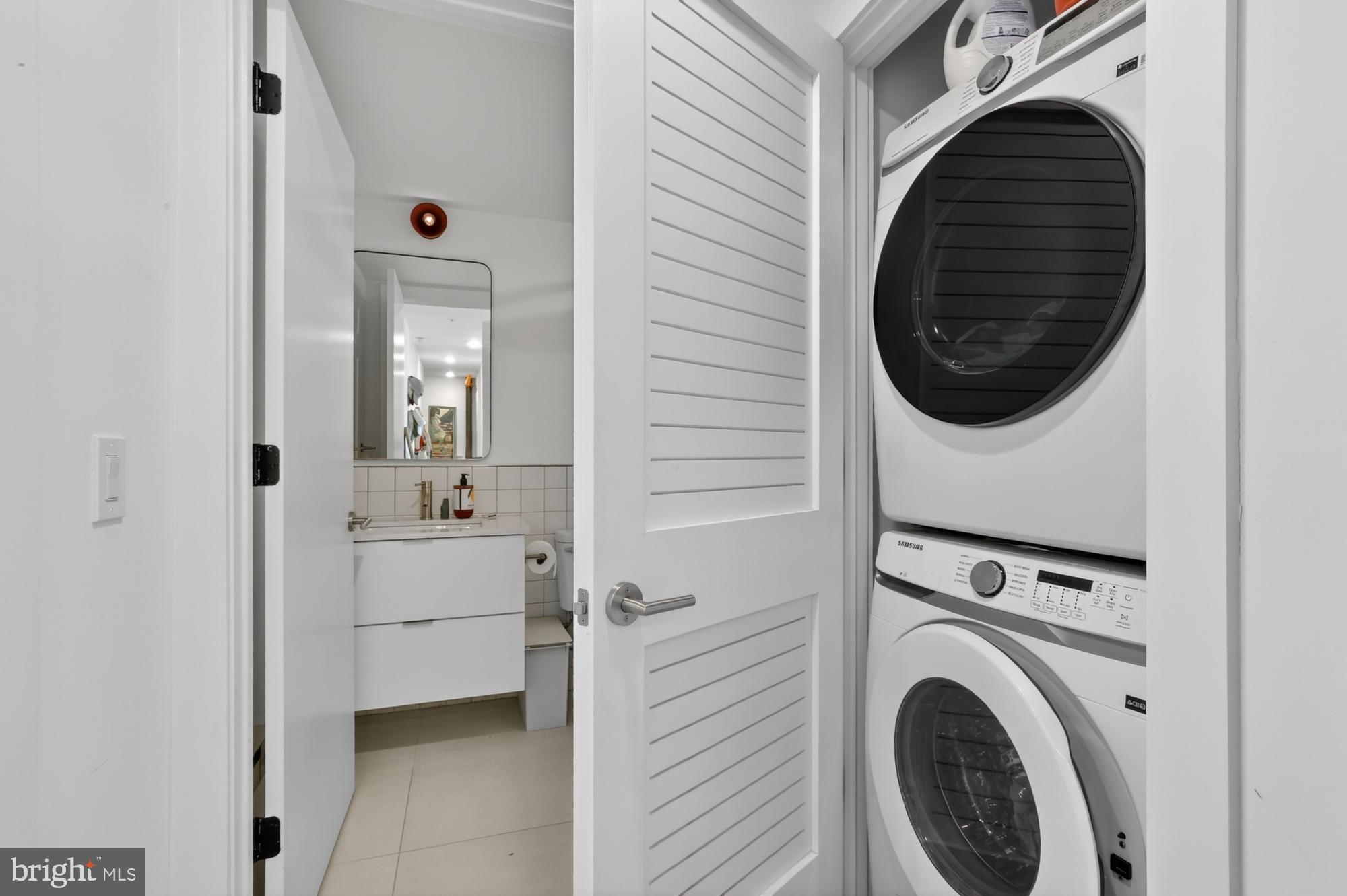 2007 Cambridge Street, Unit 9 Philadelphia, PA 19130 - Photo 15 of 33 a view of a hallway with washer and dryer