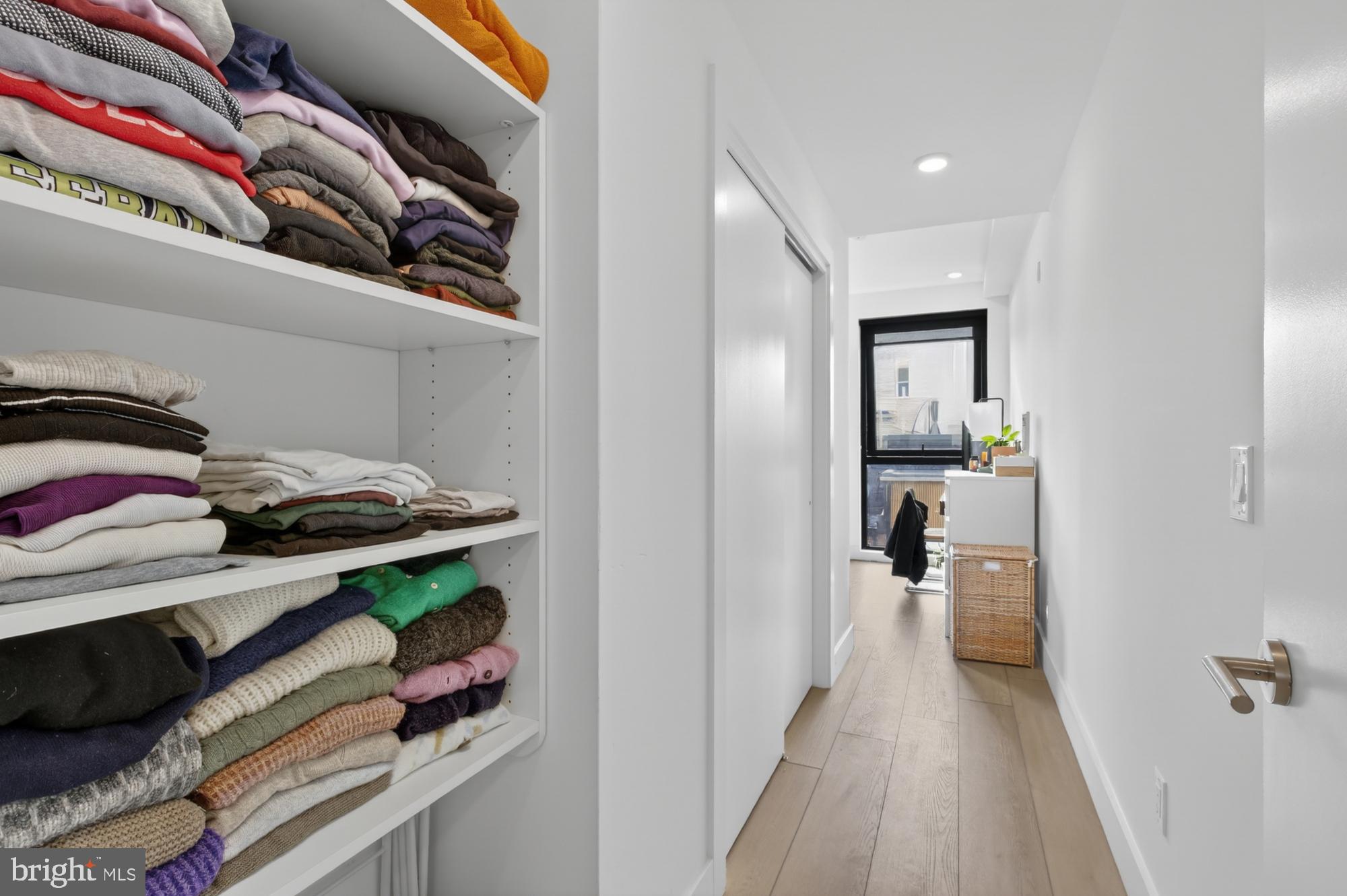 2007 Cambridge Street, Unit 9 Philadelphia, PA 19130 - Photo 16 of 33 a hallway with a bed and a closet