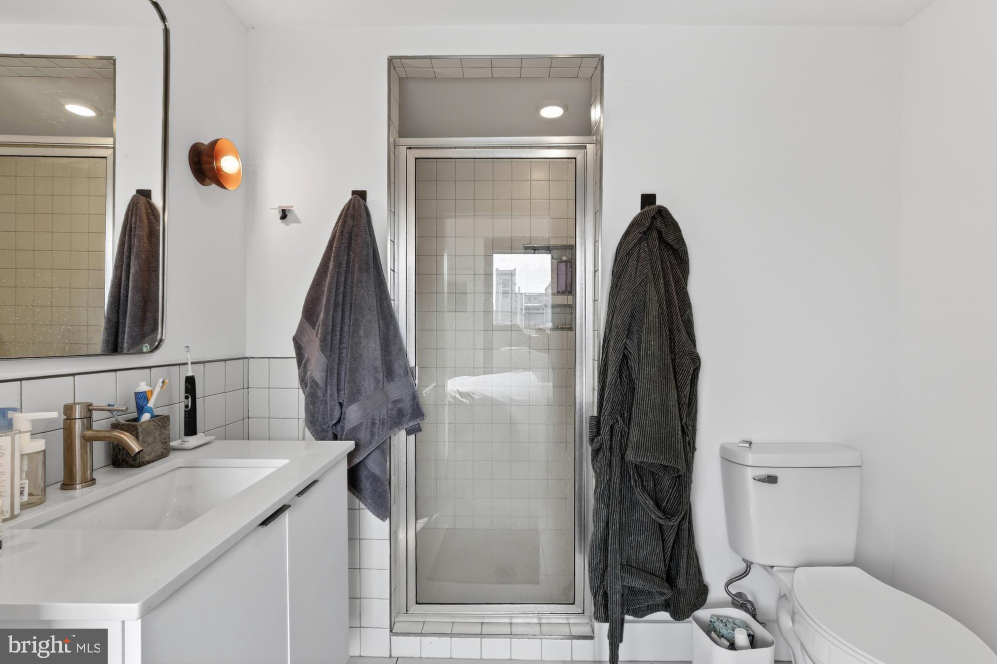 2007 Cambridge Street, Unit 9 Philadelphia, PA 19130 - Photo 20 of 33 a bathroom with a sink vanity and toilet