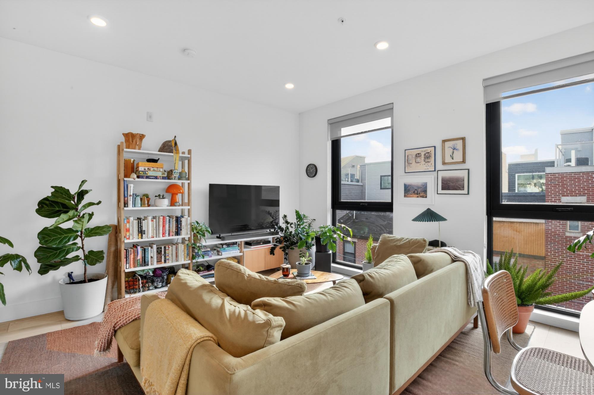 2007 Cambridge Street, Unit 9 Philadelphia, PA 19130 - Photo 7 of 33 a living room with furniture and a flat screen tv