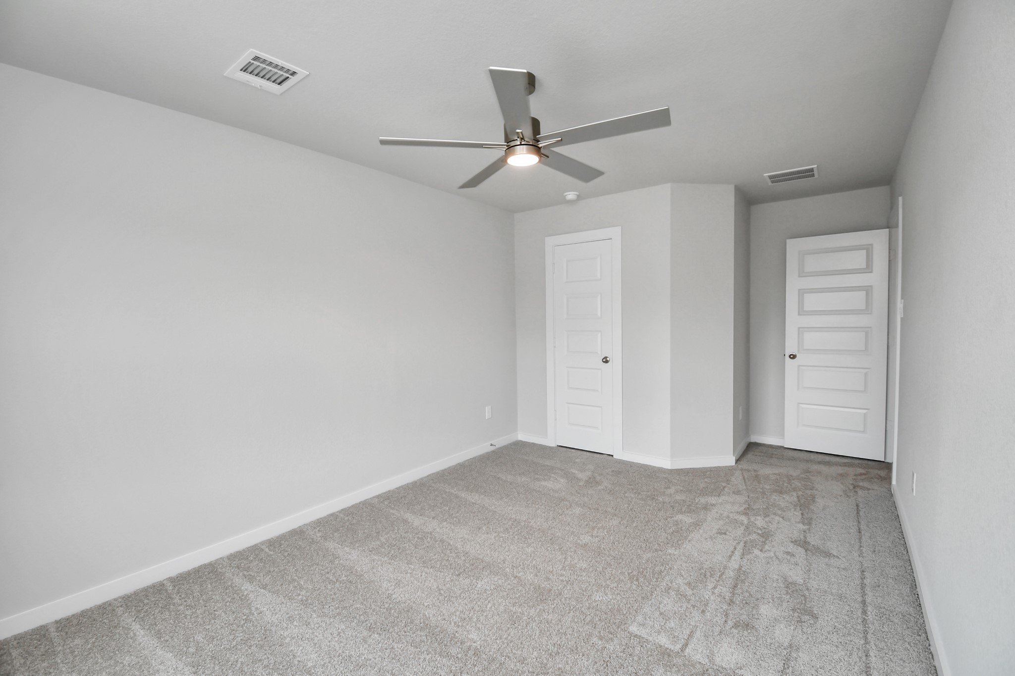 3043 Native Spg Drive Spring, TX 77373 - Photo 29 of 39 Generously sized secondary bedrooms featuring spacious closets, soft and inviting carpeting underfoot, large windows allowing plenty of natural light, and the added touch of privacy blinds for your personal retreat. Sample photo of completed home with similar floor plan. Actual colors and selections may vary.