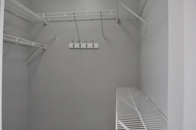 a bathroom with a bathtub sink and mirror
