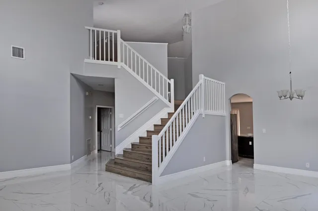 a view of entryway and hall with a front door