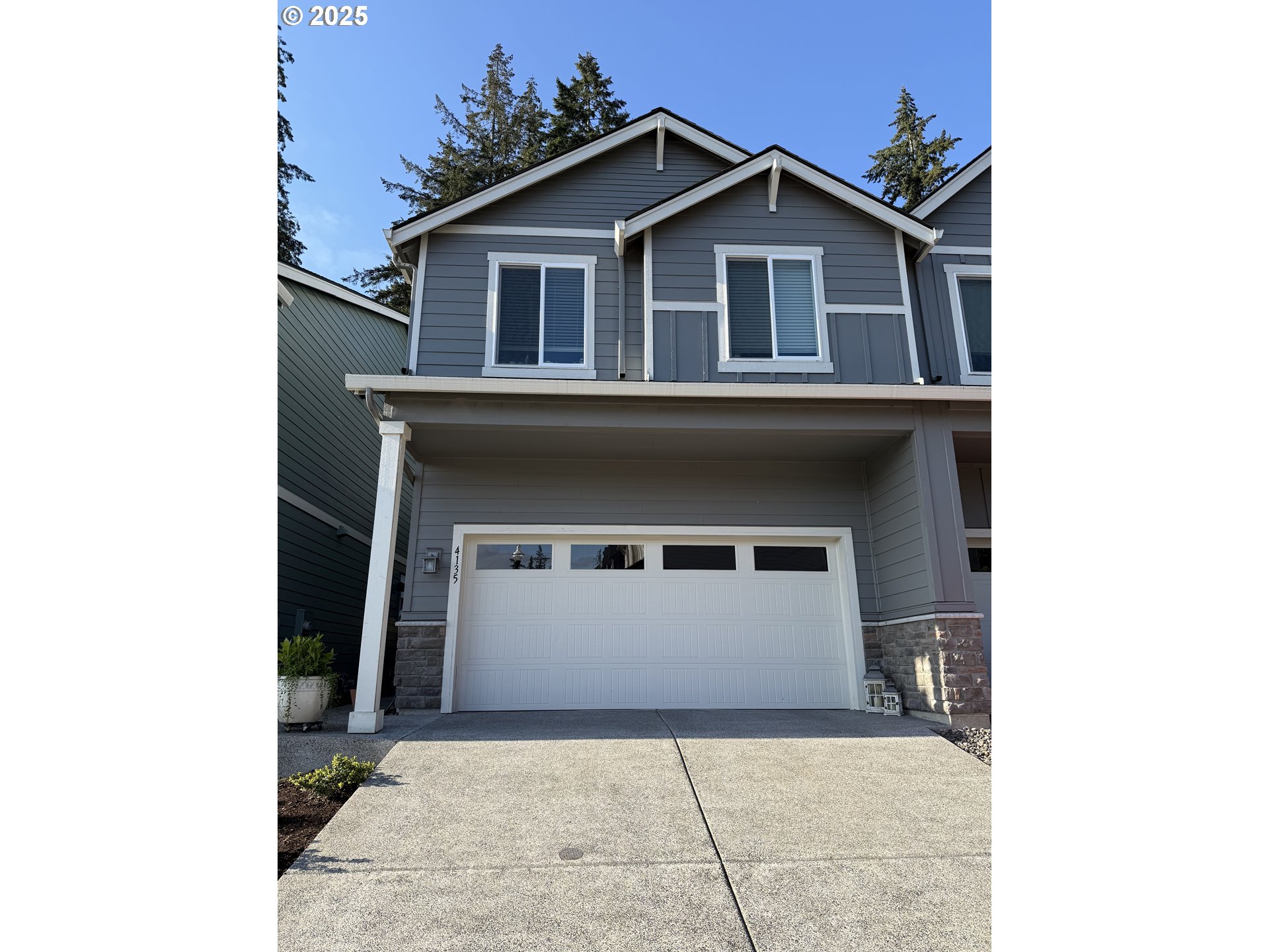 4135 South Canyon View Circle Ridgefield, WA 98642 - Photo 1 of 25 a front view of a house with a garage