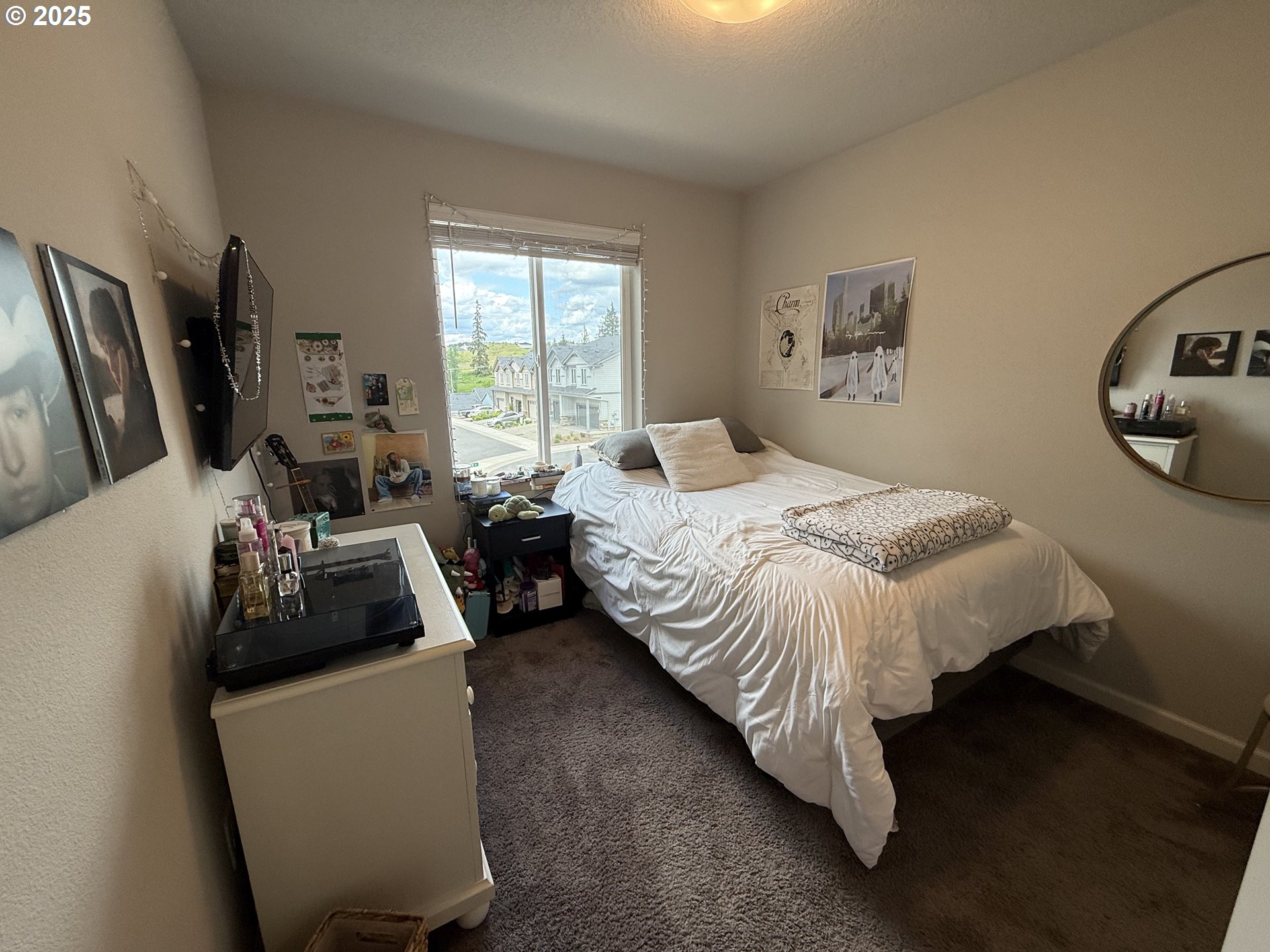 4135 South Canyon View Circle Ridgefield, WA 98642 - Photo 17 of 25 a bedroom with a bed a couch and dresser
