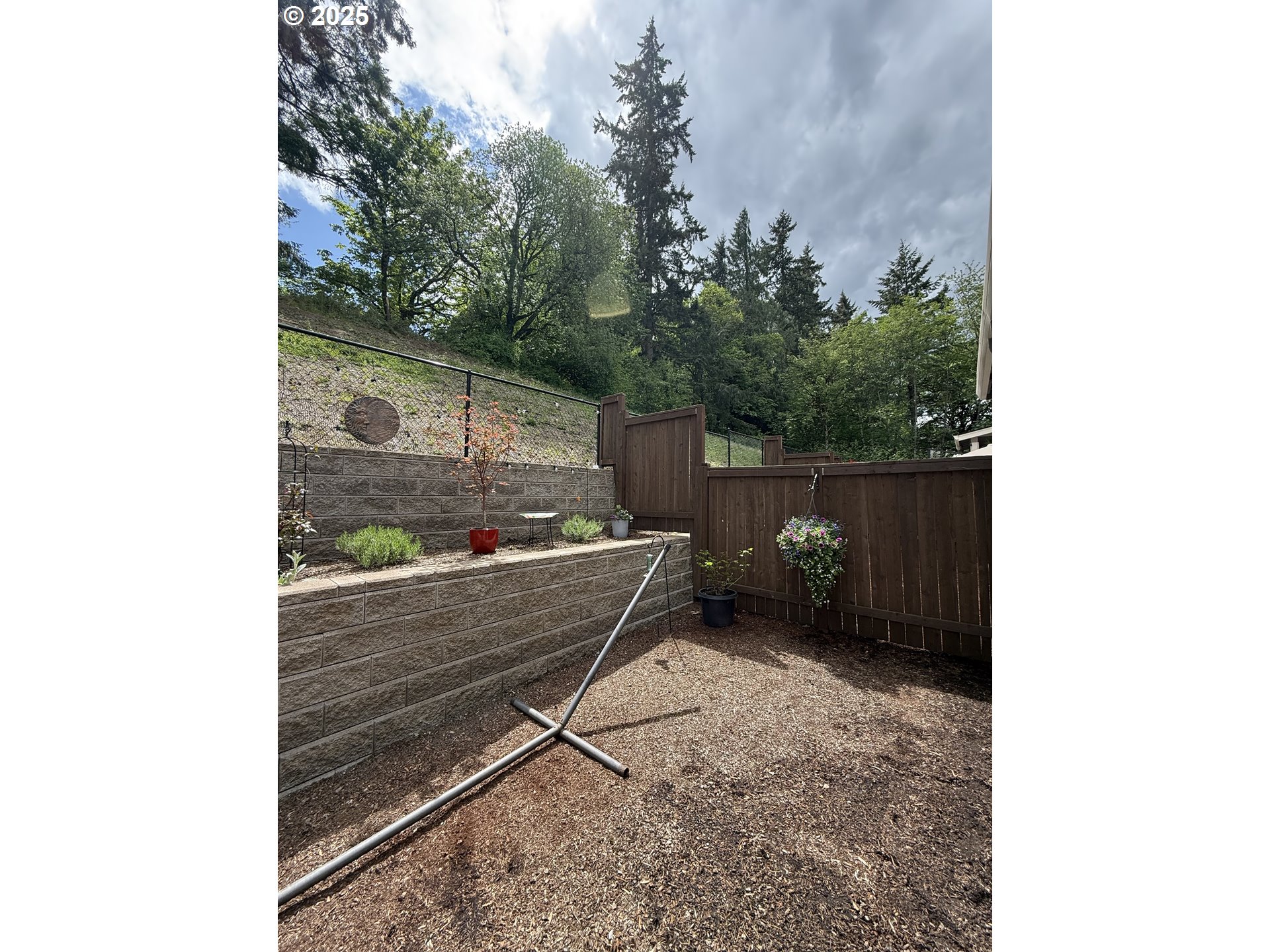 4135 South Canyon View Circle Ridgefield, WA 98642 - Photo 21 of 25 a backyard of a house with table and chairs