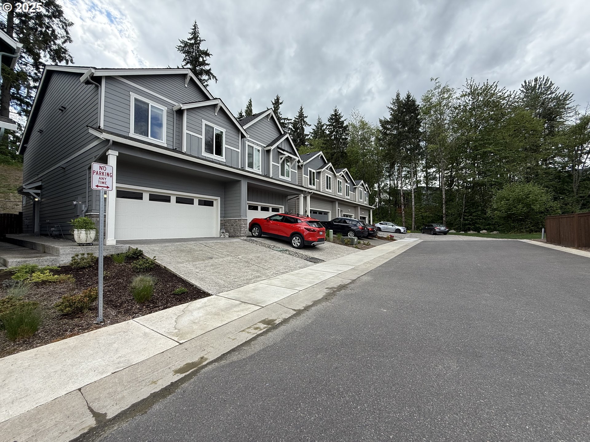 4135 South Canyon View Circle Ridgefield, WA 98642 - Photo 22 of 25 a car parked on the side of the road