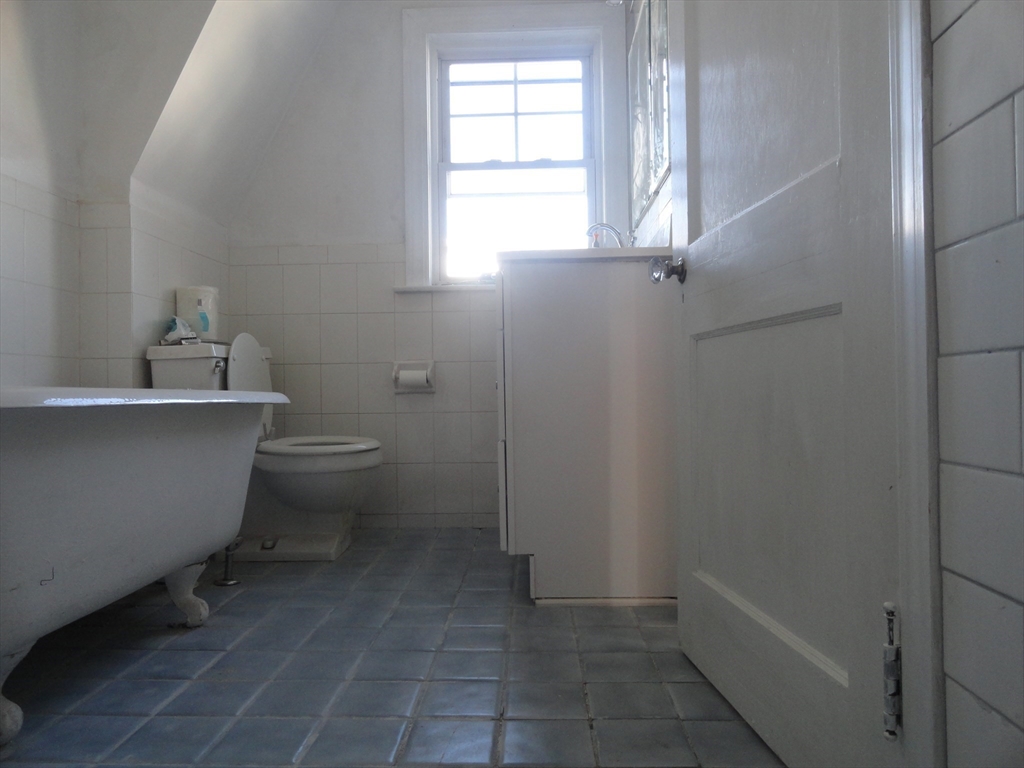 14 Rowe Hill Road Stoneham, MA 02180 - Photo 15 of 30 a bathroom with sink toilet and window