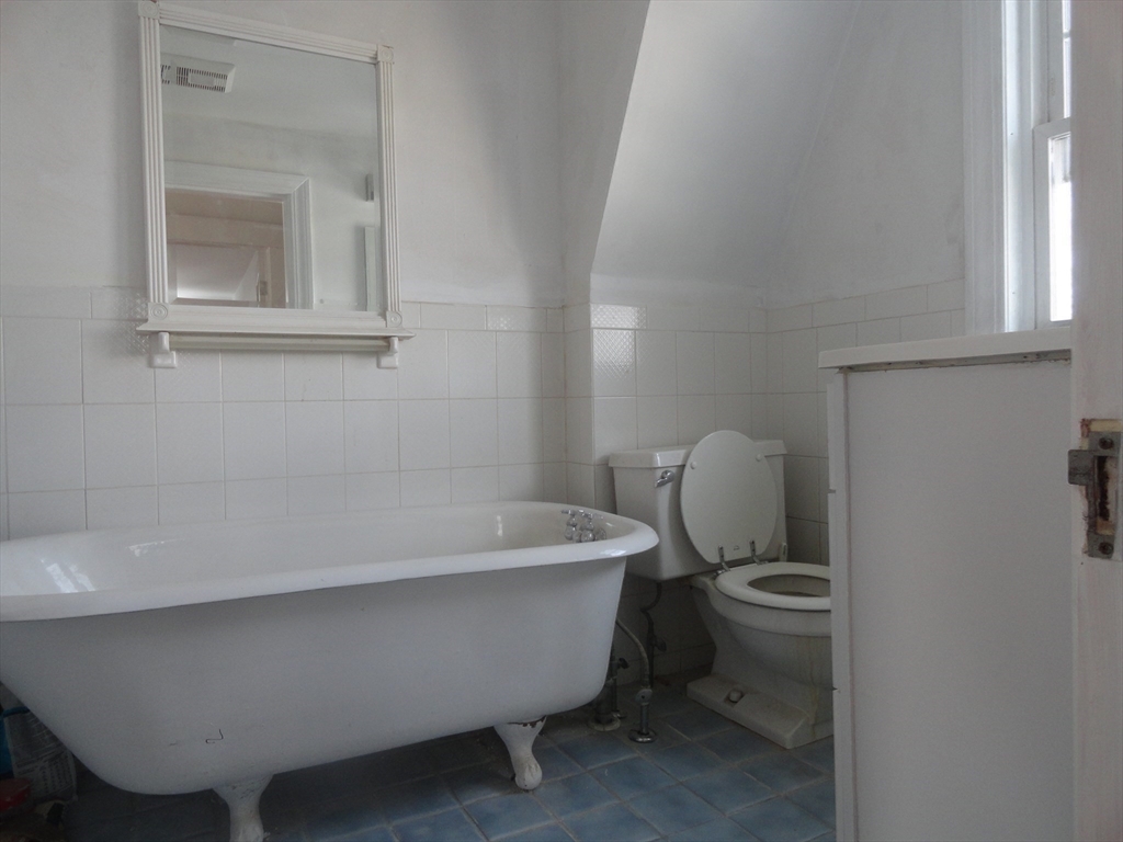 14 Rowe Hill Road Stoneham, MA 02180 - Photo 16 of 30 a bathroom with a sink and mirror