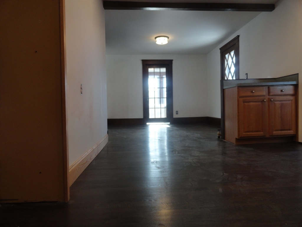 14 Rowe Hill Road Stoneham, MA 02180 - Photo 8 of 30 a view of an empty room with window and wooden floor