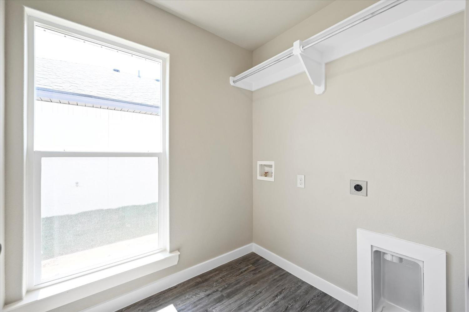 3706 Urbana Place Lubbock, TX 79407 - Photo 20 of 22 a view of a small space with wooden floor and a window
