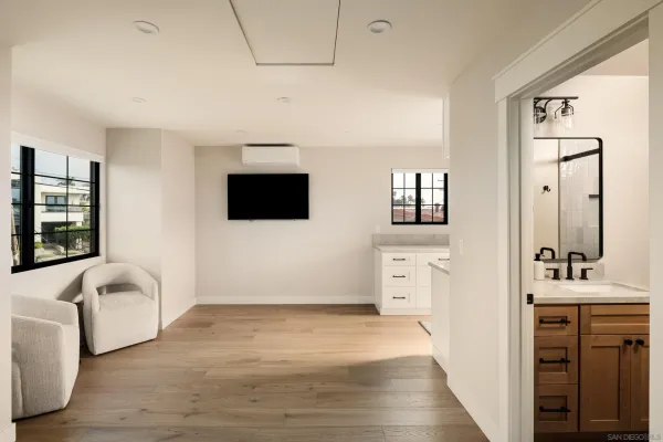 a spacious bathroom with a sink double vanity and a mirror
