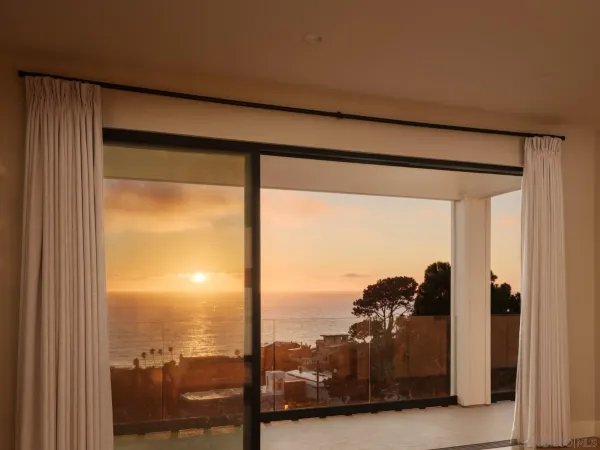 a view of a terrace with furniture and city view