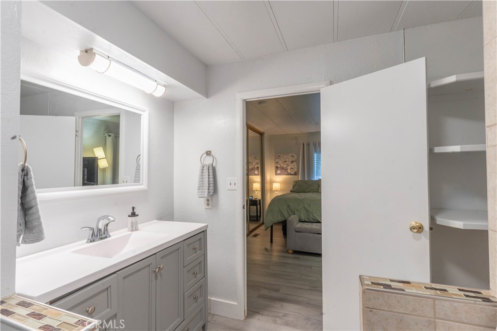 251 South Colorado River Road, Unit 38 Blythe, CA 92225 - Photo 13 of 19 a en suite bathroom with a sink and a mirror